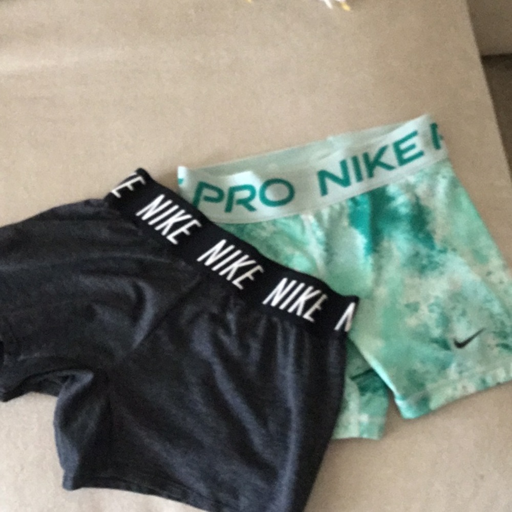 Two pairs of Nike shorts medium for both!